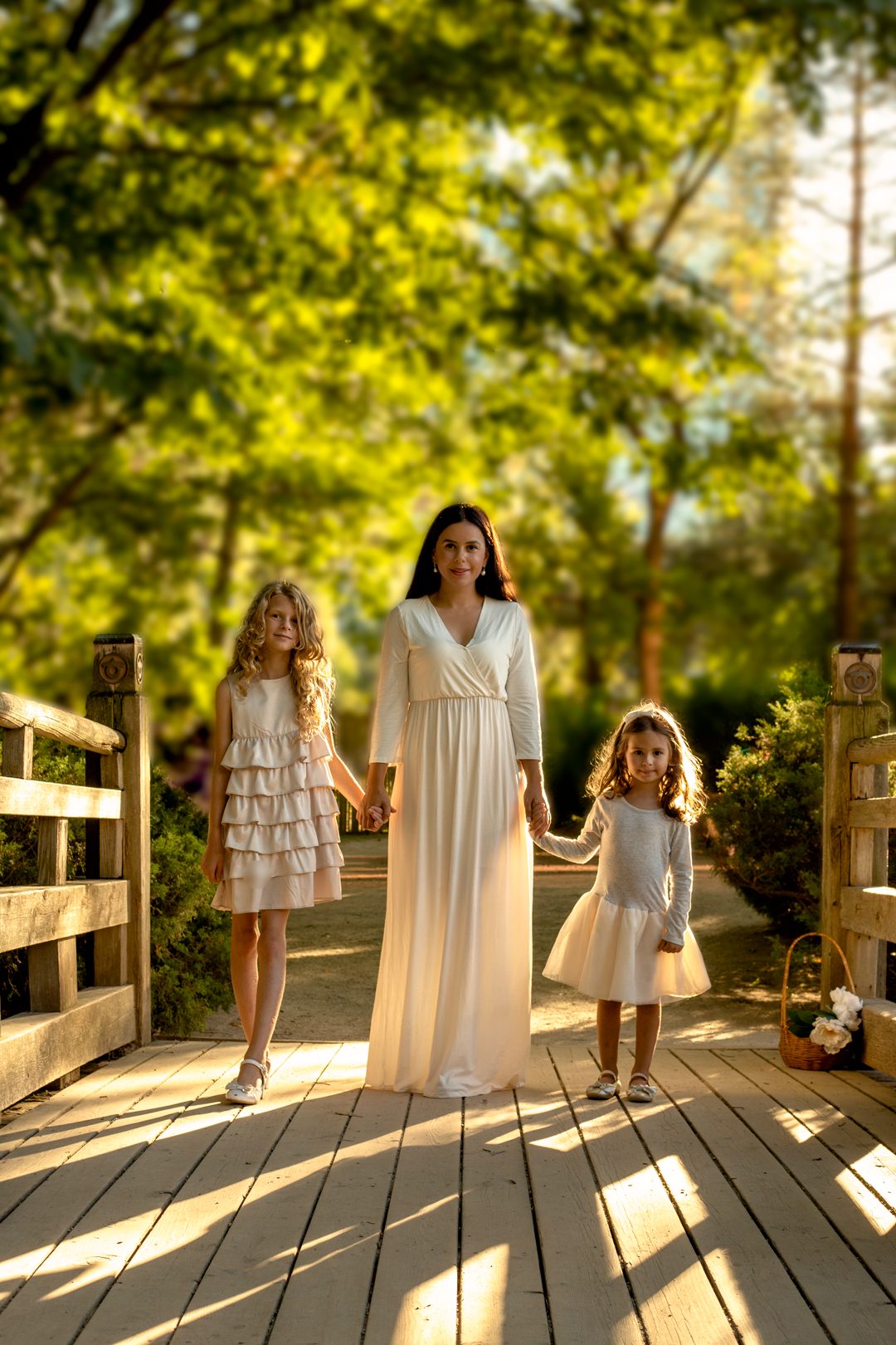 Mother and daughter forehead touch on a bridge