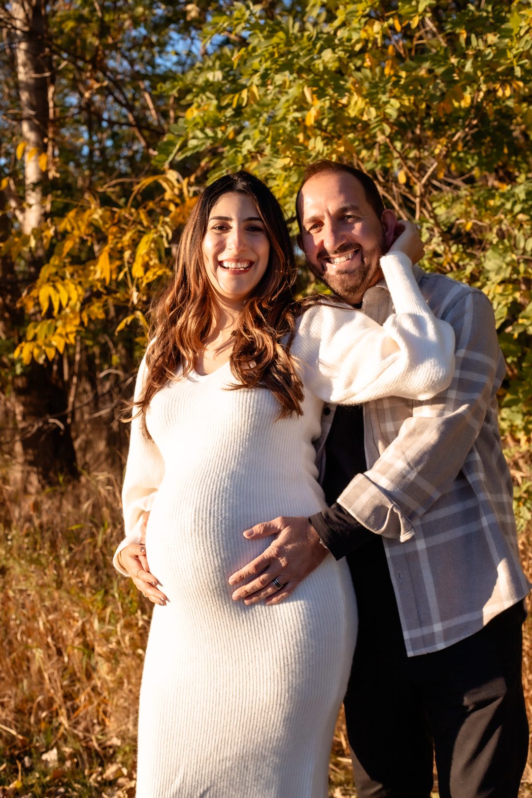Maternity couple smiling together